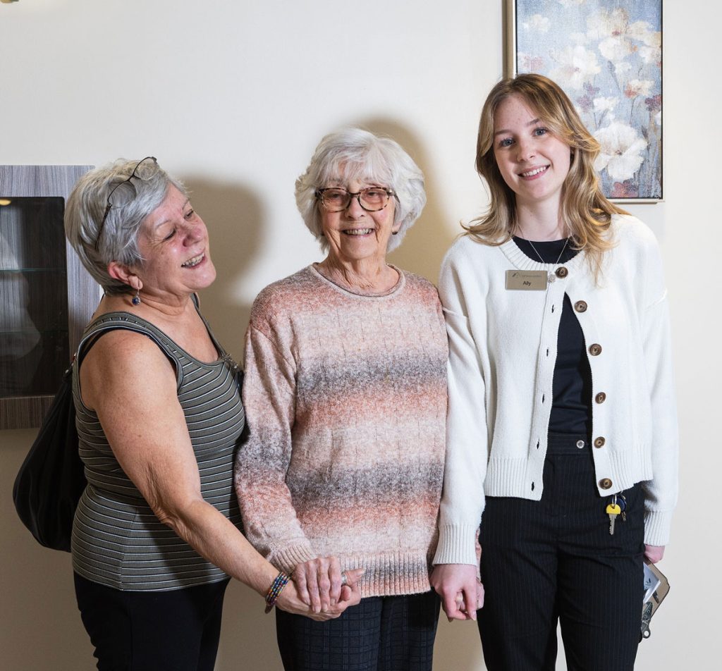 resident with family member and team member